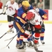 Frisco's Christopher Mertz and Marcus's Austin Horka battle for the puck during third-period, AT&T Metroplex action Sunday night in McKinney.  Frisco teammates Brandon Steele and Eric Alford move in to assist.