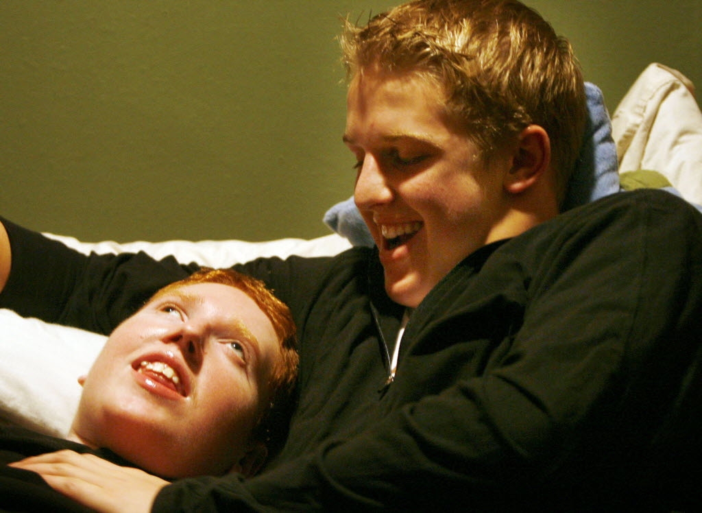 Hockey player and his brother with a disability